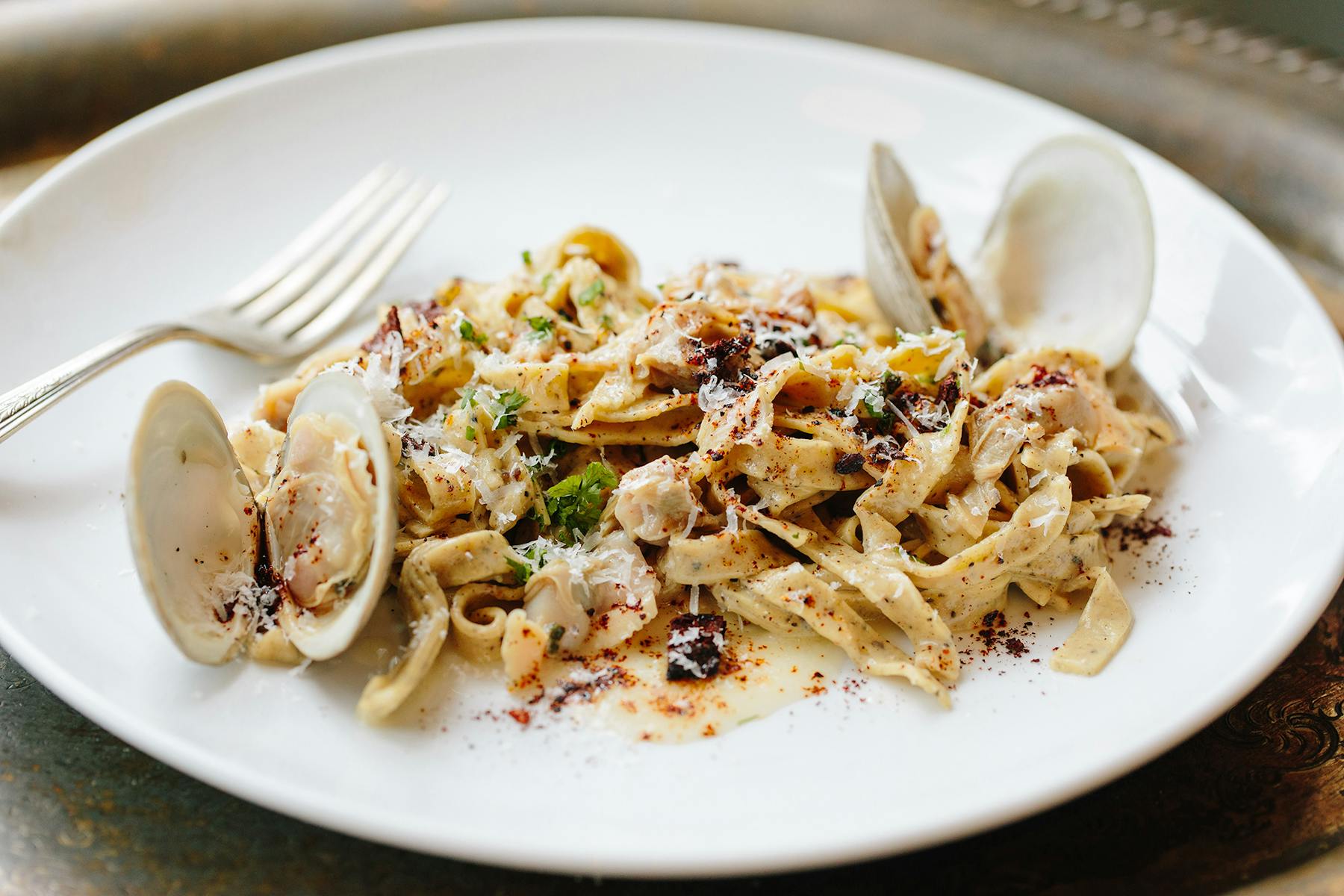 a plate of pasta with oysters